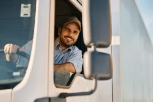 Smiling Truck Driver Looking out Truck Window