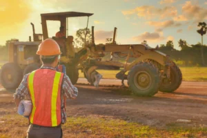 Earthmoving machinery on-site at dusk; illustrating fast loan approval services for Diesel Dirt and Turf Expo 2026 attendees.